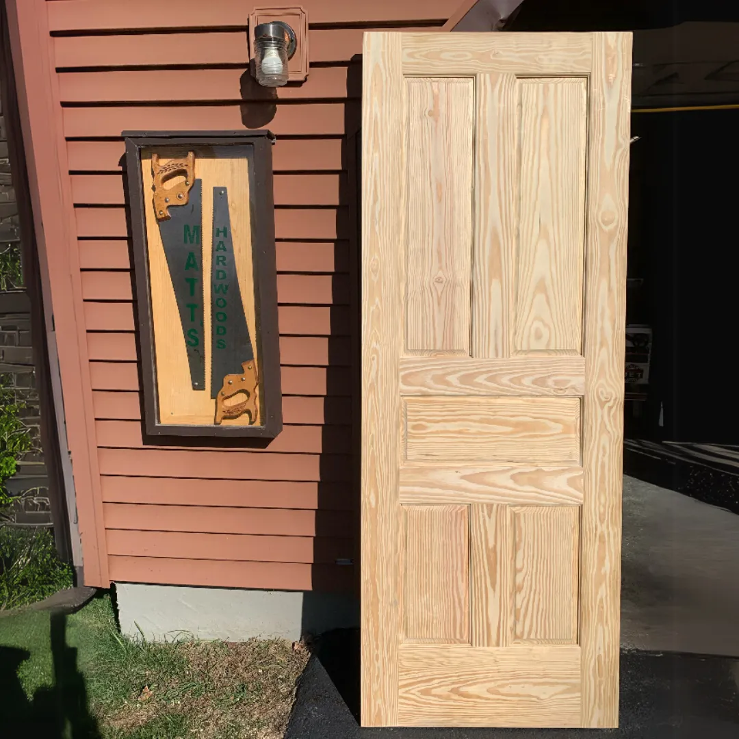 custom yellow pine door that matches other doors in the home